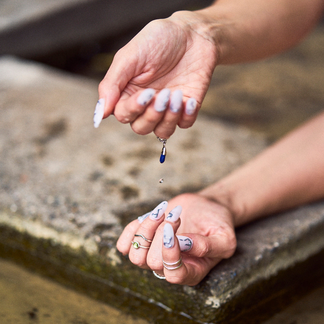 Hands full of rings playing with water